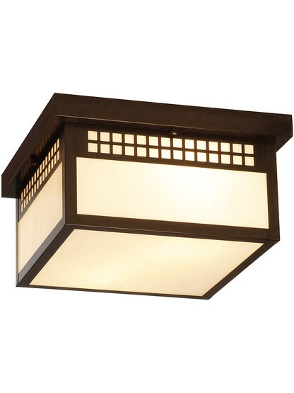 Glasgow Family Flush Mount Fixture in Bronze Finish with White Opalescent Glass.